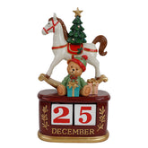 Calendario natalizio con cavallo a dondolo e orsacchiotto in resina H 23,5 cm